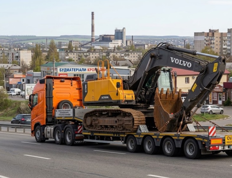 Як безпечно перевозять спецтехніку у Вінниці: професійне транспортування екскаватора на низькорамній платформі.